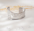 Bracelet à courbes fluides en acier inoxydable – Élégance minimaliste & raffinement moderne